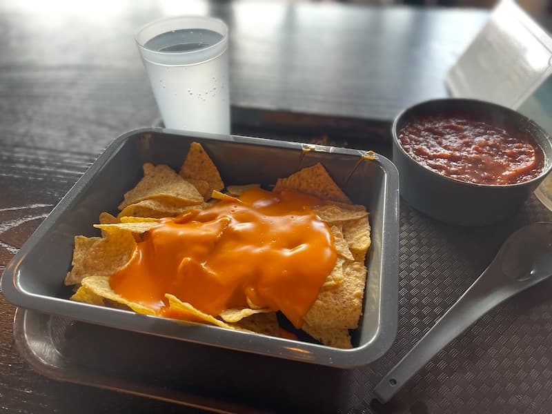 Nachos with cheese and vegan chili, served on eco-friendly dishes, something that may surprise first time visitors to Disneyland Paris