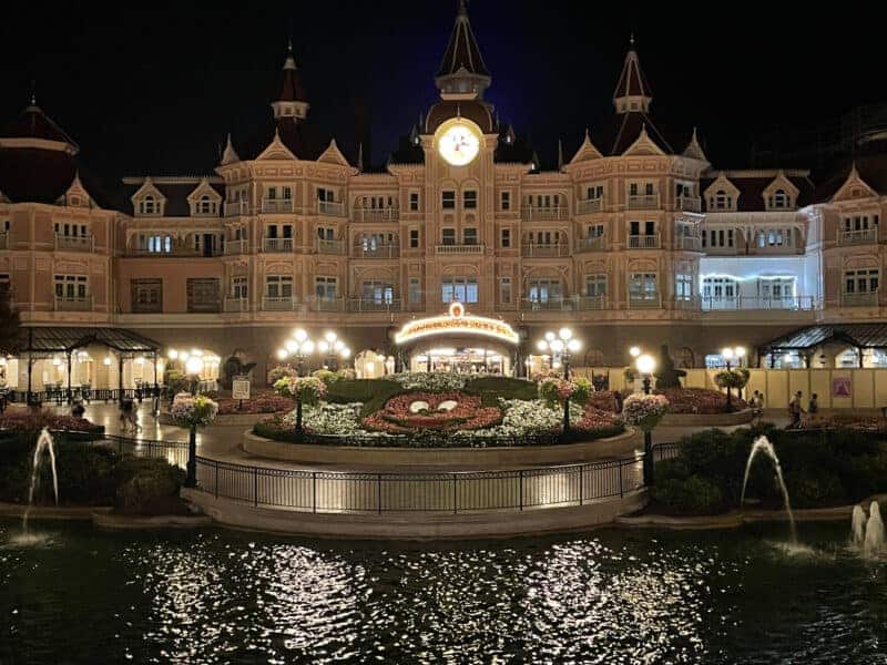 Disneyland Paris entrance and fountains at night
