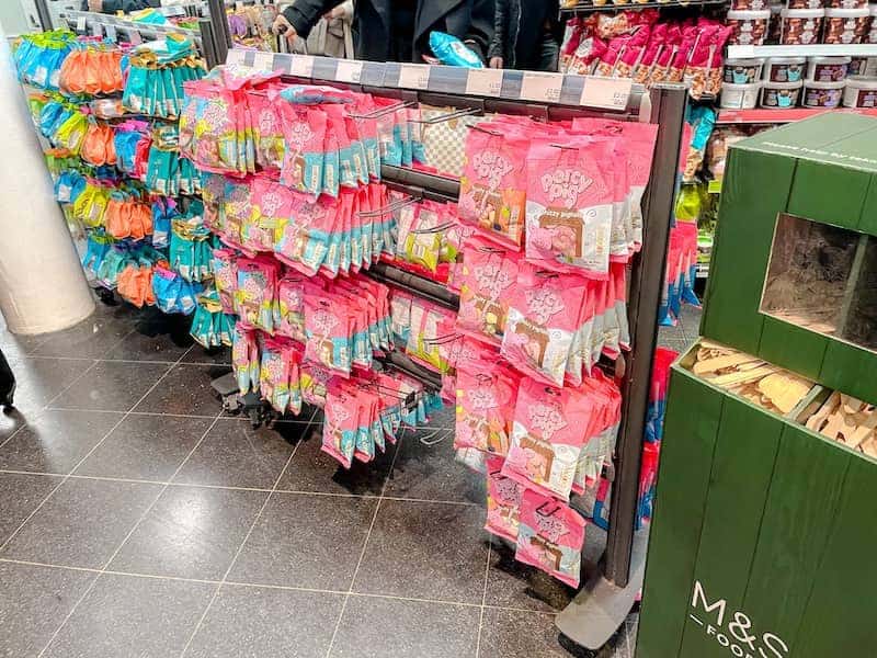 A stand inside M&S Food in St Pancras has a colourful selection of sweets including pretty pink bags of Percy Pigs