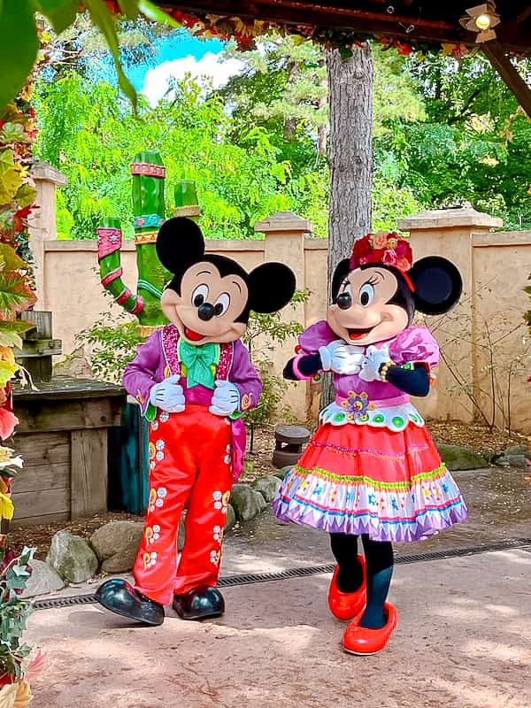 Mickey and Minnie Mouse are dressed in festive Mexican outfits - two Halloween characters at Disneyland Paris