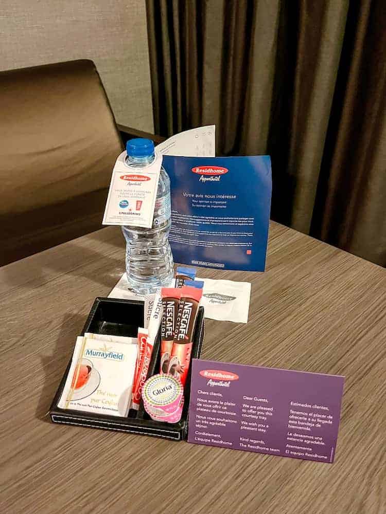 Complimentary bottle of water, tea, coffee and biscuit provided at Residhome Val d'Europe for Disneyland Paris guests