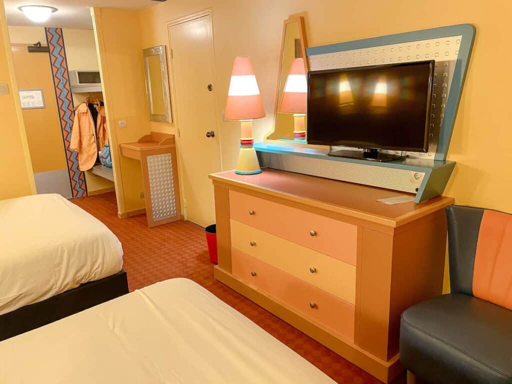 Interior view of Disney Hotel Santa Fe with Cars theming. There is ample room on the two beds to have breakfast in the hotel room