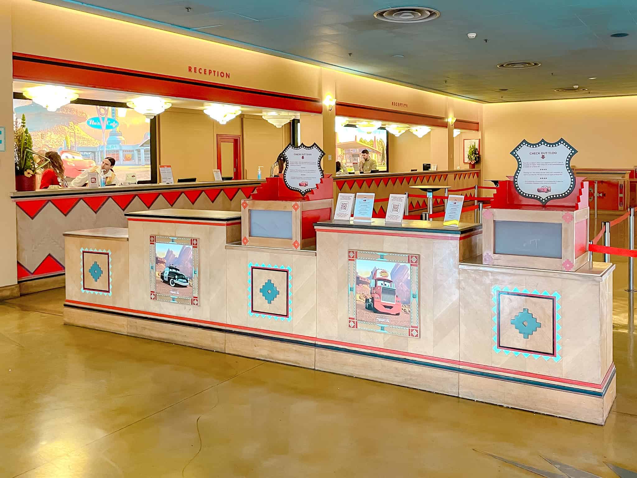 Disney Hotel Santa Fe reception area with several desks and few cast members busy at work