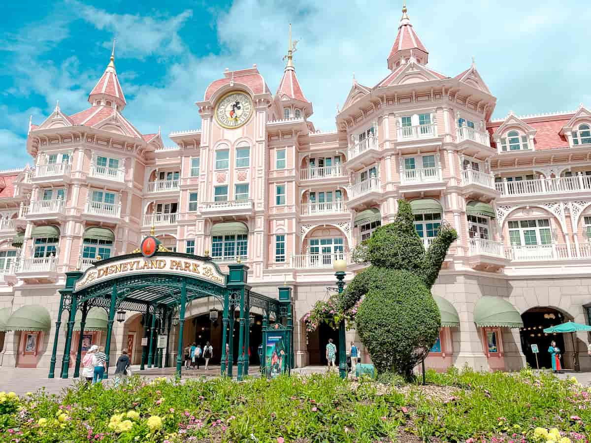 The Disneyland Hotel is pretty in pastel pink as it sits above the park entrance. It's 5-star status makes it one of the best hotels at Disneyland Paris.