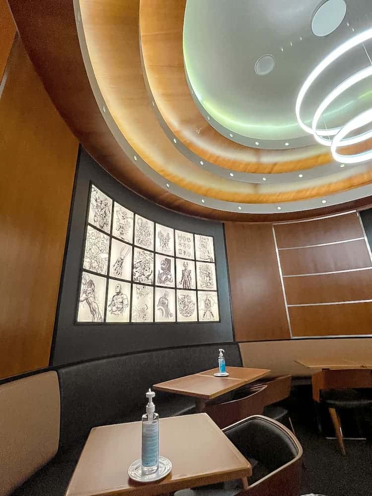 The Downtown Restaurant Disneyland Paris seating area is decorated with comic pages showing different superheroes.