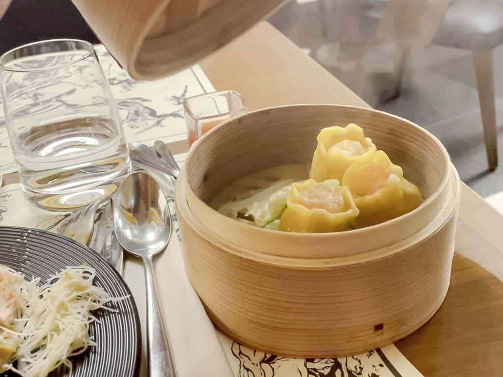 A dim sum pot with shrimp dumplings inside