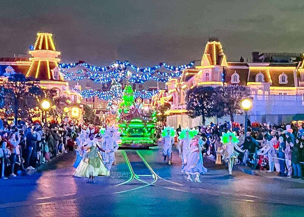 The grand finale of Mickey’s Dazzling Christmas Parade features illuminated floats, dancers and Disney Princesses (as viewed from the paid Reserved Access area), a spectacular conclusion to the festive celebration.