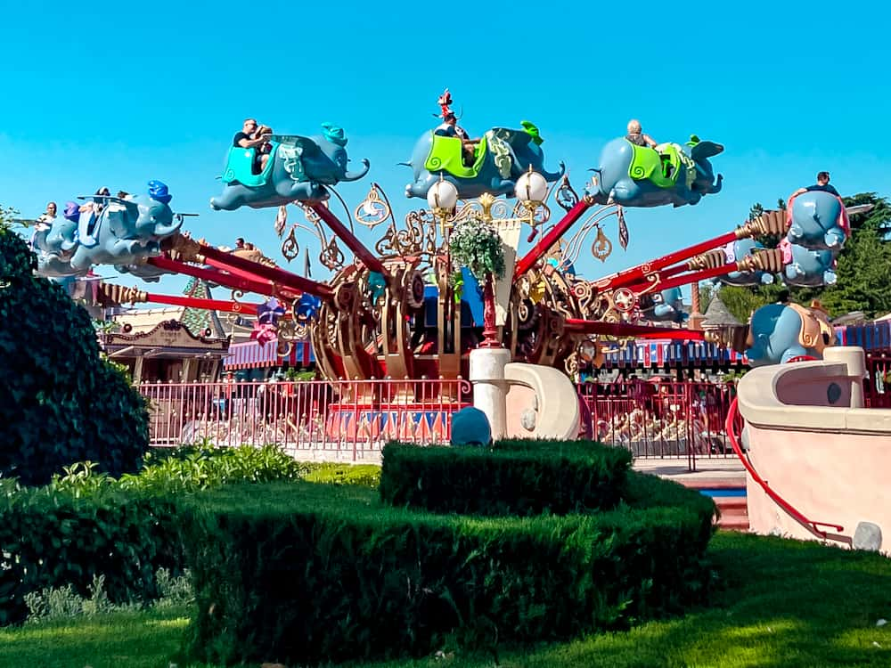 Dumbo the Flying Elephant attraction in Fantasyland Disneyland Paris is filled with guests of all ages including parents with small children. The cute elephants are dressed in different colours and soaring up. Dumbo is perfect for a 1-day Disneyland Paris itinerary for families as it's fun for all ages.