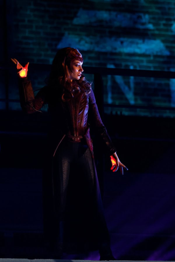 Scarlet Witch glowing with magical energy on the rooftop near Flight Force during the new Doctor Strange: Mystery of the Mystics show at Disneyland Paris.