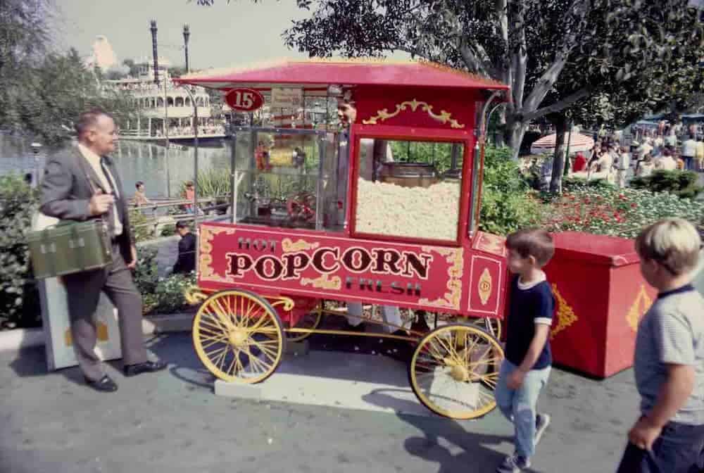 A vintage Disneyland popcorn cart featuring a classic spinning popcorn doll, the design that inspired Disneyland Paris's charming creations.