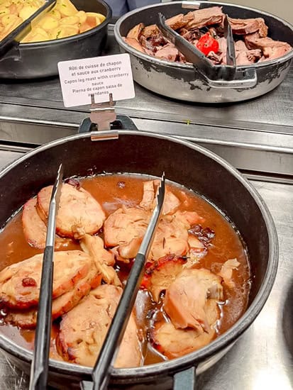 Carved capon roast with cranberry sauce at the Plaza Gardens character buffet in Disneyland Paris.