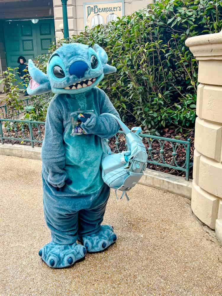 Pixie dust example: Stitch character holding sweets at Disneyland Paris, a fun birthday moment in the parks