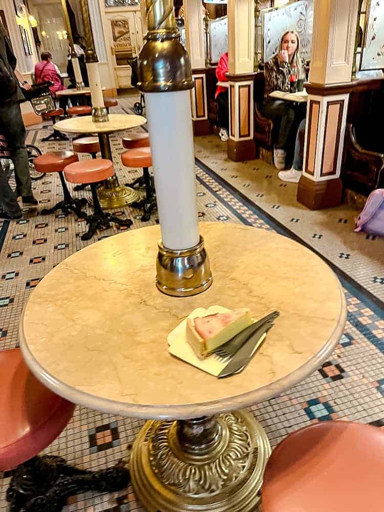 Cheese quiche on a marble café table at Cable Car Bake Shop in Disneyland Paris, part of a one day trip