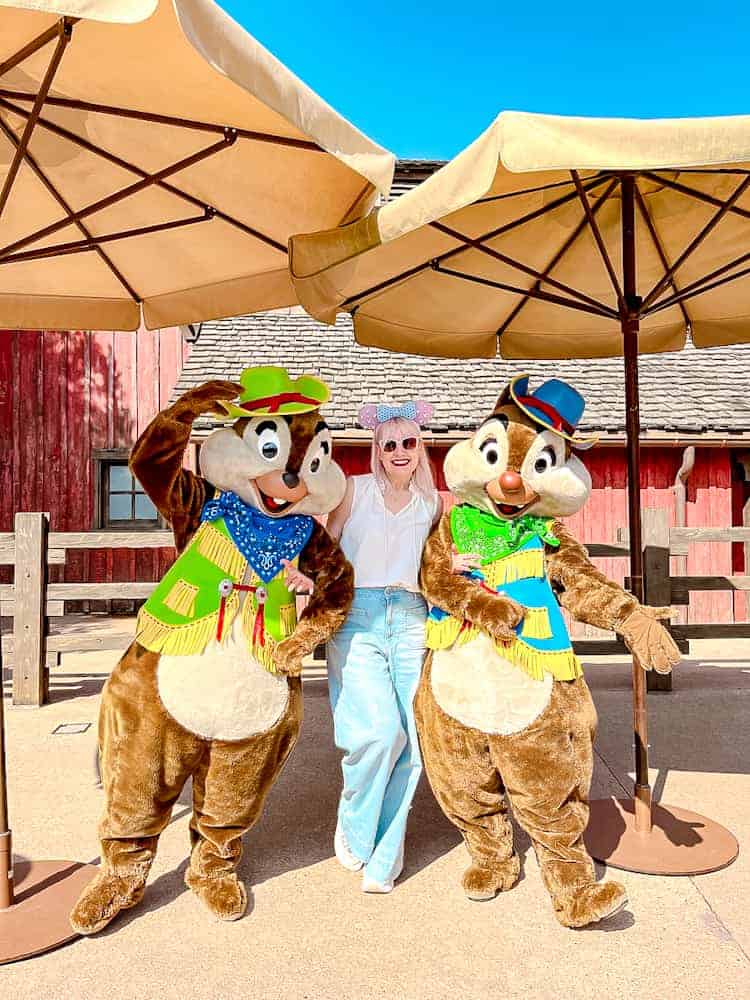 Disneyland Paris blogger Carrie-Anne with Chip and Dale in bright spring costumes at Disneyland Paris during a one day visit