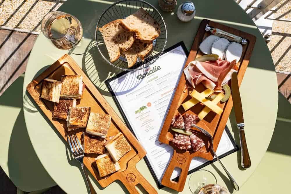 Cheese and charcuterie sharing boards with croque-monsieur toast served at Petite Rosalie Terrace in Disneyland Paris