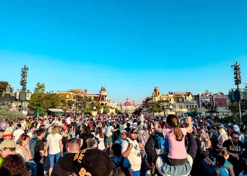 Huge crowd gathered for the Disney Music Festival finale at the Disneyland Paris hub. Shows the scale and popularity of the event.