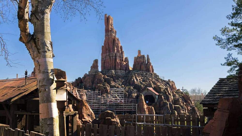 The rocky peaks of Big Thunder Mountain during refurbishment at Disneyland Paris, with scaffolding showing ongoing maintenance work