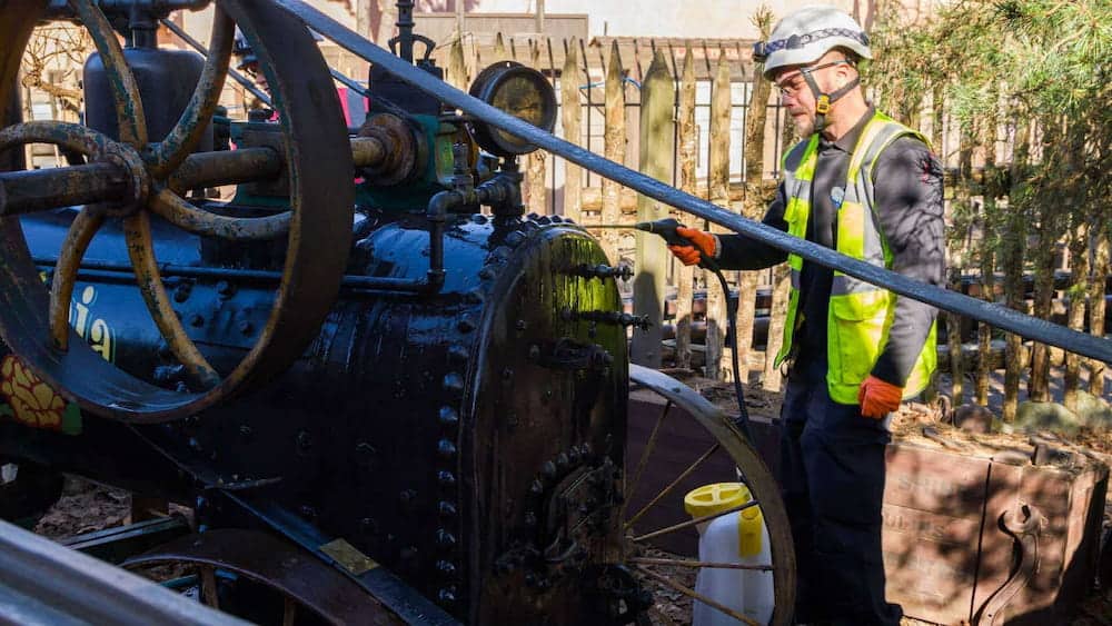 Technician working on the Lavinia steam engine at Big Thunder Mountain, part of the detailed refurbishment process