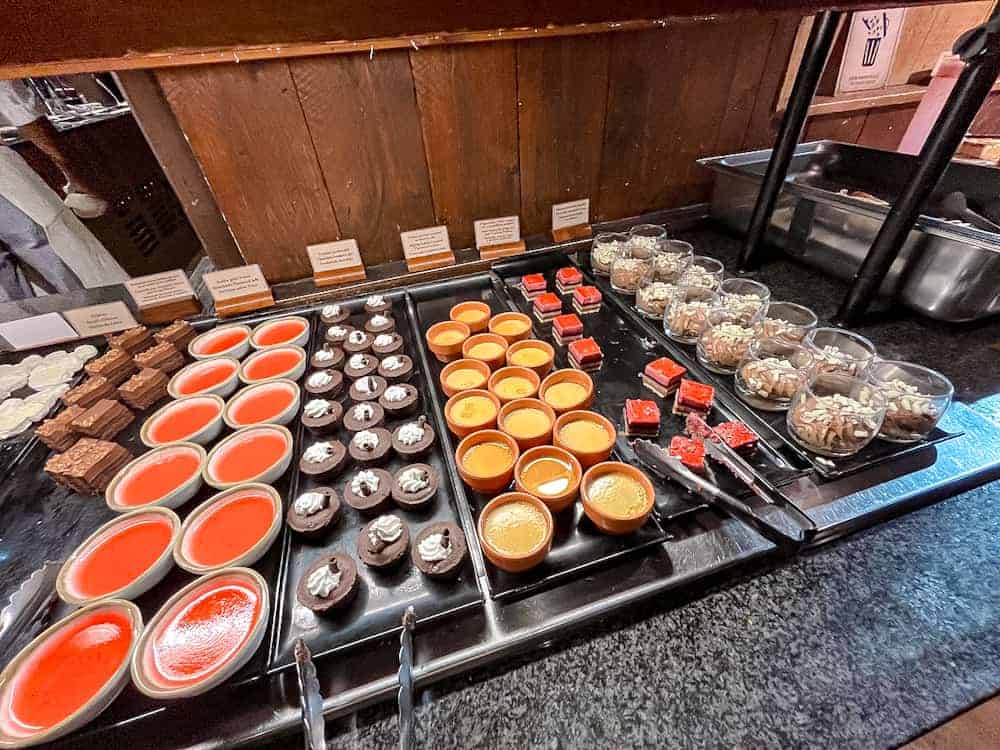 A colourful selection of mini desserts including mousse, panna cotta, brownies, and jelly cubes at the Disneyland Paris Billy Bob’s buffet.