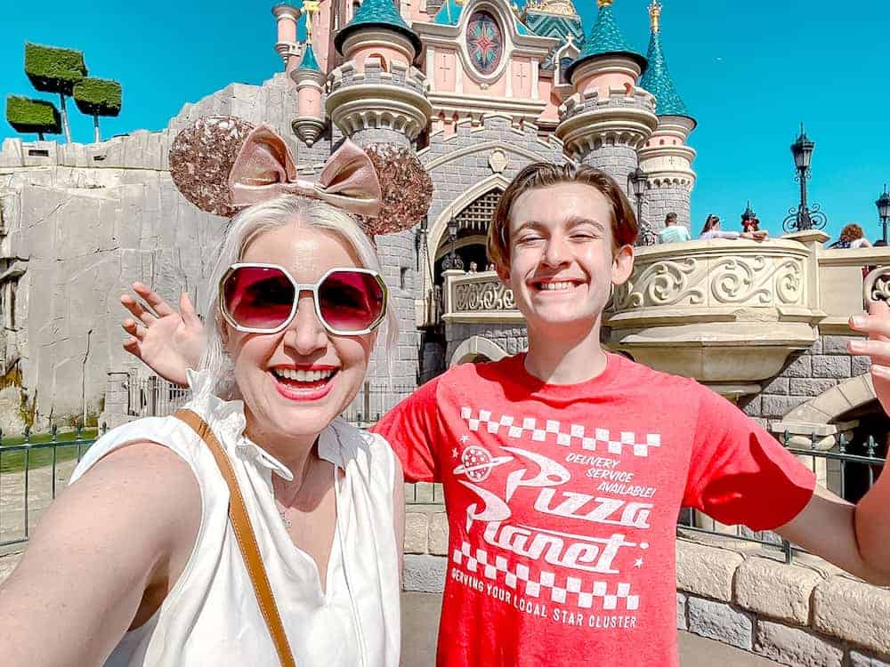 Carrie-Anne at Disneyland Paris in front of Sleeping Beauty Castle