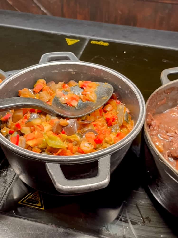 A pot of colourful Mediterranean-style vegetable stew with red and green peppers, aubergine, and onions at the Billy Bob’s La Grange hot food buffet.