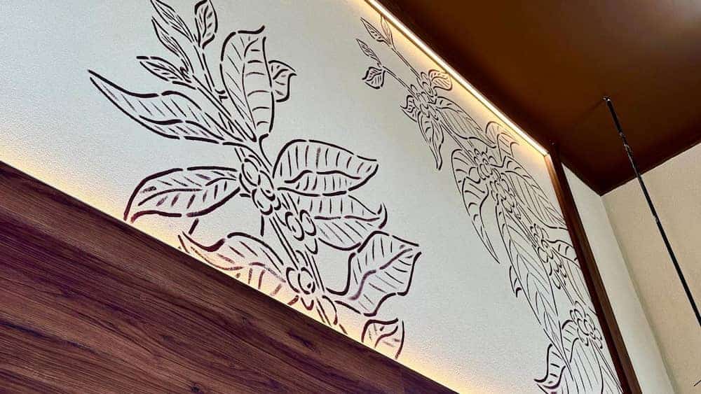 Botanical-inspired line art on the walls of Starbucks at Disney Hotel Cheyenne, adding to the stylish Western theme.