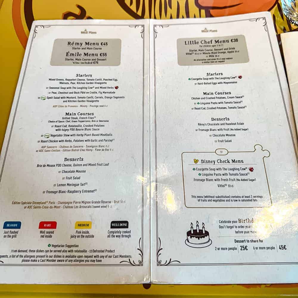 Food menu at Bistrot Chez Rémy in Disneyland Paris showing Rémy Menu, Émile Menu, and Little Chef children’s menu with prices