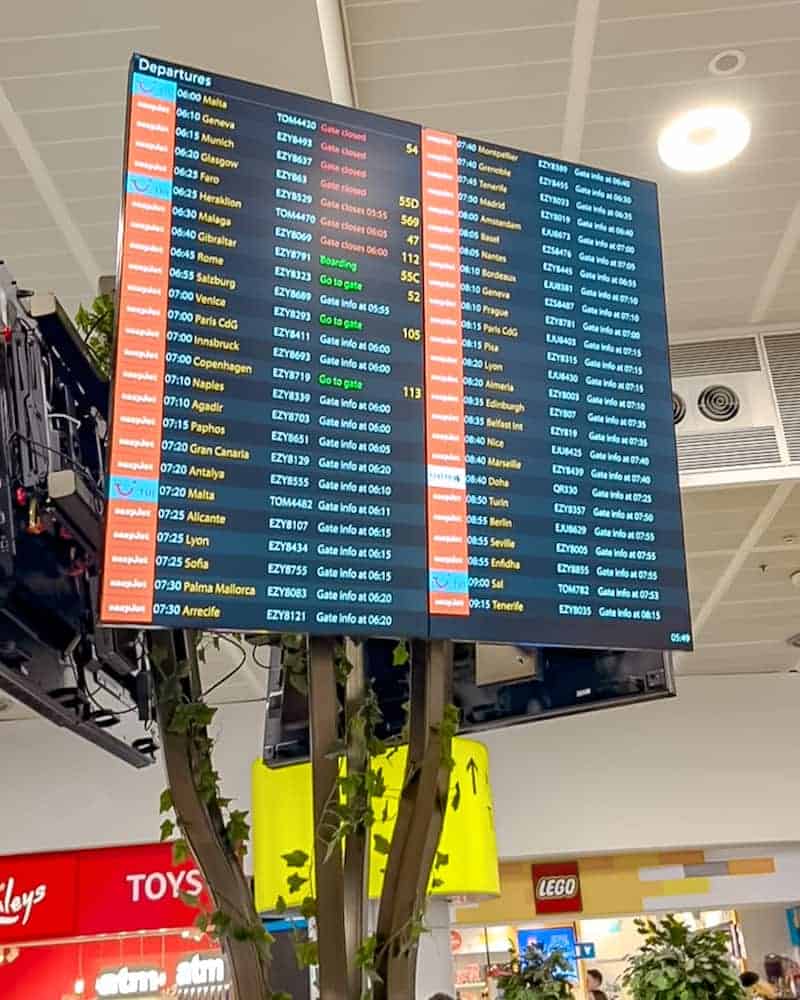 Airport departure board showing multiple flights, representing delays and cancellations expected during the French Air Traffic Control Strike September 2025.