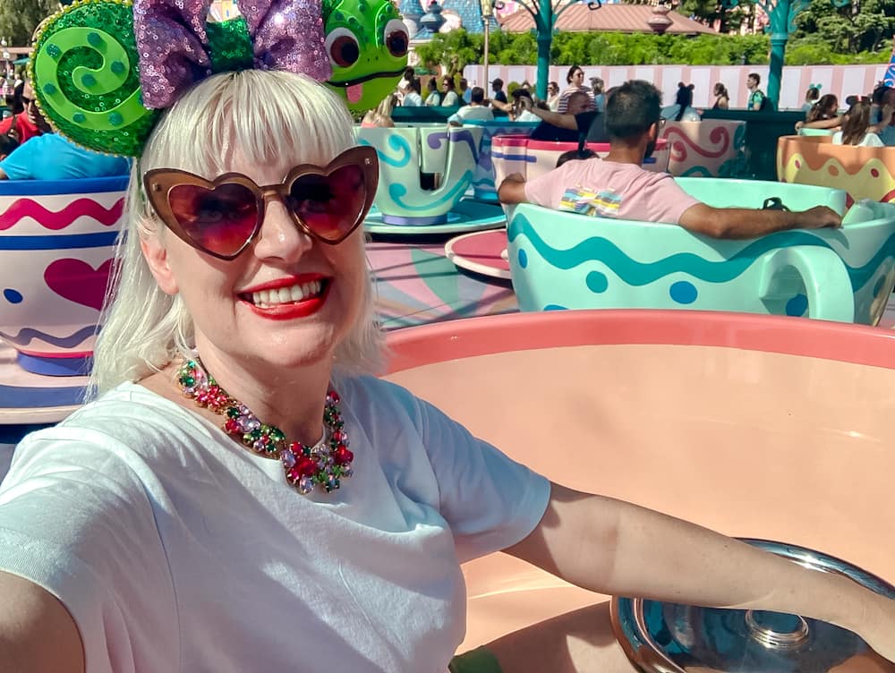 DLP blogger Carrie-Anne enjoying the Mad Hatter’s Tea Cups ride in September at Disneyland Paris.