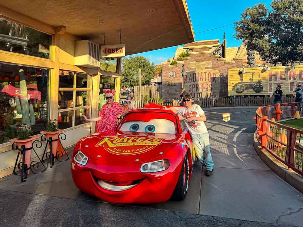 Carrie-Anne and her son meeting Lightning McQueen in Cars Land, a highlight of their 3-Day Disneyland California Itinerary.