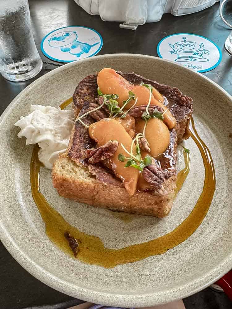 Peach-topped French toast at Lamplight Lounge in California Adventure, one of the foodie highlights of our 3-Day Disneyland California Itinerary.