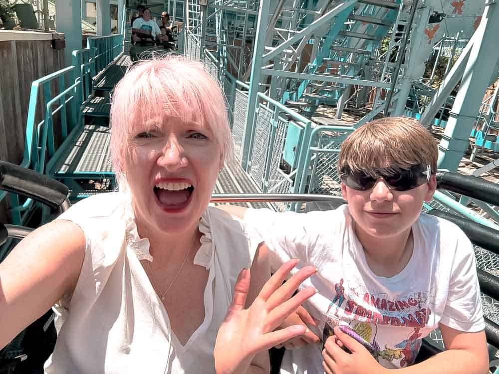 Mother and son in coaster car on Goofy’s Sky School ride at Disney California Adventure.