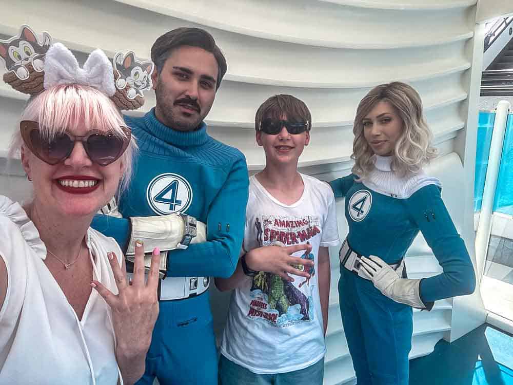 Family posing with Mr. Fantastic and Invisible Woman during the Fantastic Four promotion in Tomorrowland at Disneyland California.