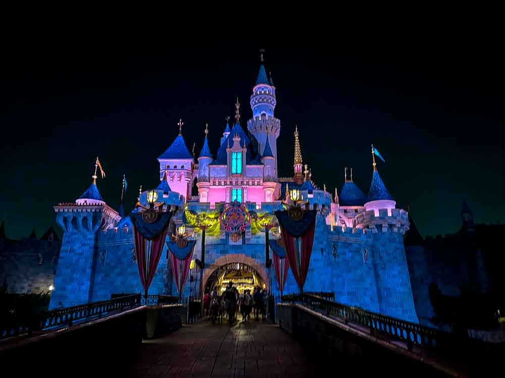 Sleeping Beauty Castle glowing at night, one of the iconic sights from our 3-Day Disneyland California Itinerary.