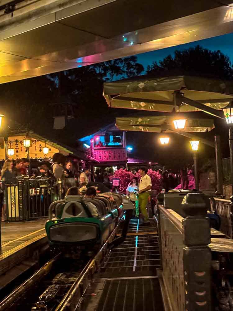 Guests boarding the Matterhorn Bobsleds at night, one of the thrill rides in our 3-Day Disneyland California Itinerary.