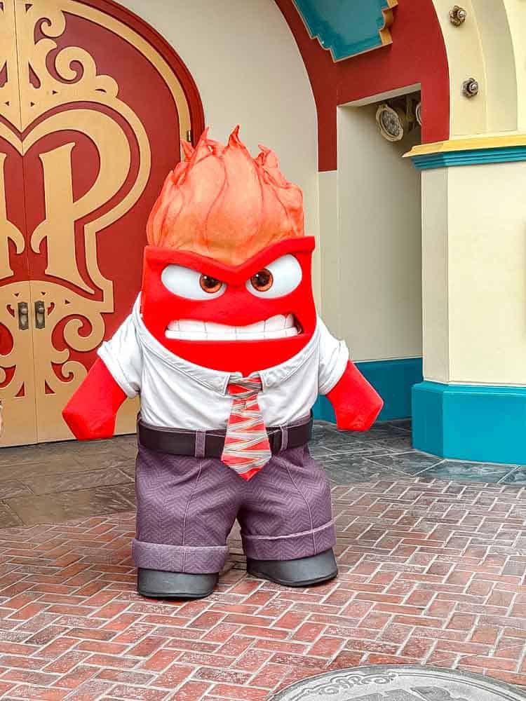 Anger from Pixar’s Inside Out meeting guests at Disneyland California, a fun character encounter on our 3-Day Disneyland California Itinerary.