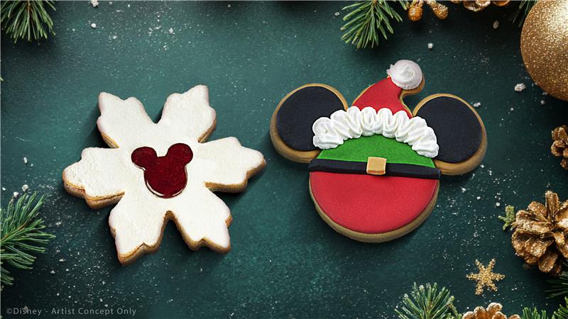 Festive Mickey and snowflake cookies for Disneyland Paris Christmas 2025, decorated with red, green, and gold holiday details.