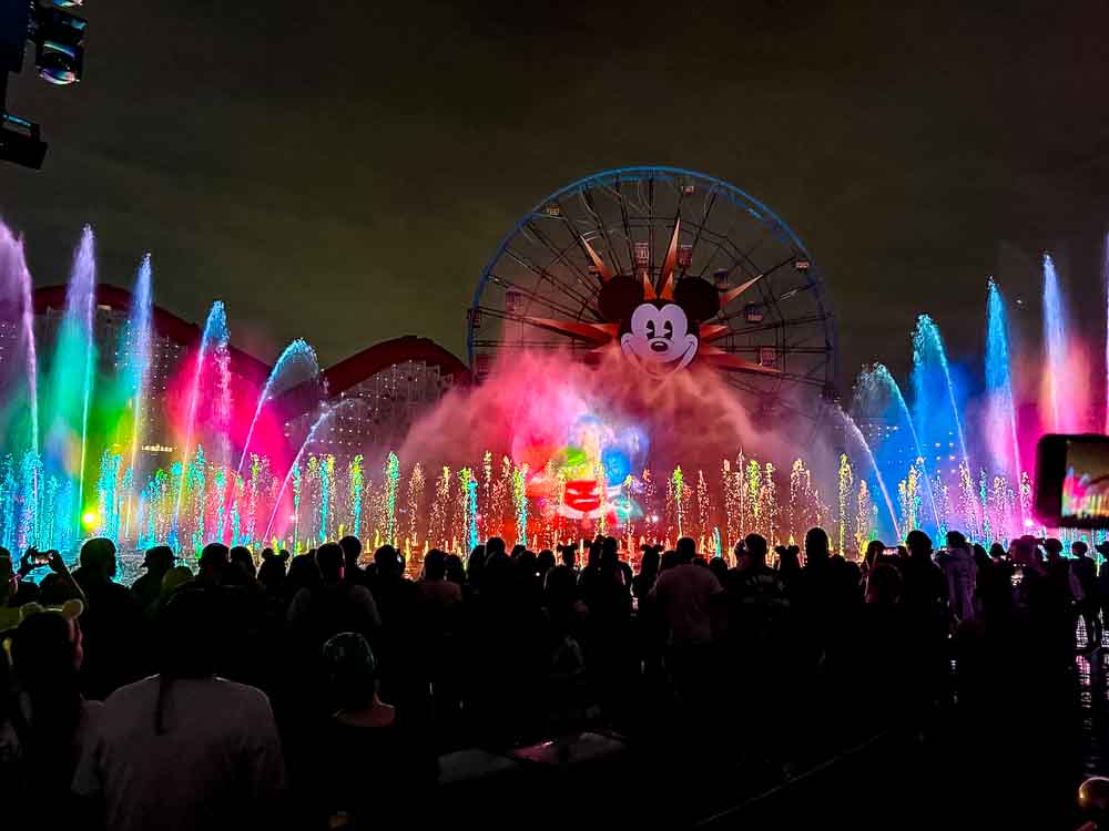 Guests watching the World of Color fountain and projection show at Disney California Adventure during a 3-Day Disneyland California Itinerary.