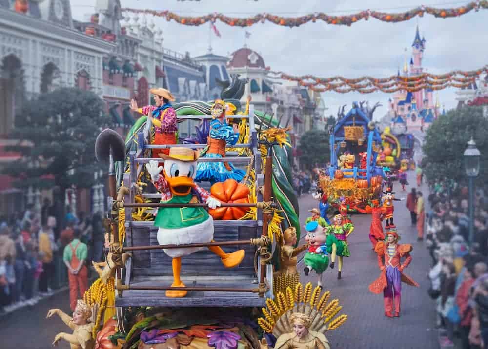 Donald Duck on a colourful float decorated with pumpkins and autumn leaves in Mickey’s Halloween Celebration parade at Disneyland Paris 2025.