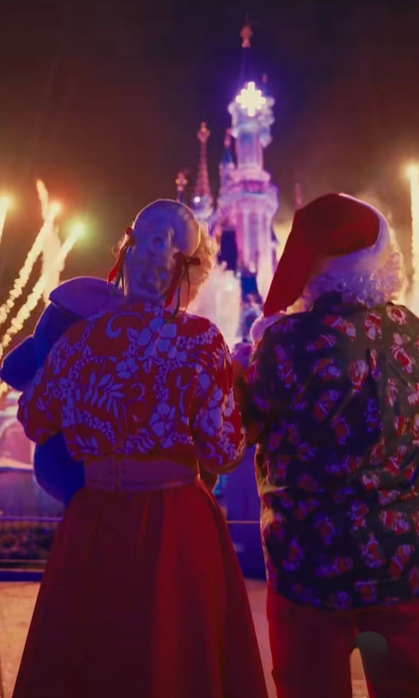 Santa Claus and Mrs Claus watching fireworks above Sleeping Beauty Castle during Disneyland Paris Christmas 2025 celebrations.