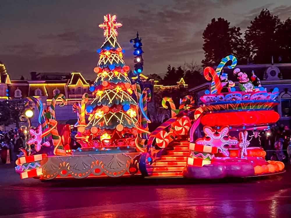 Mickey’s Dazzling Christmas Parade illuminated floats and performers at Disneyland Paris.