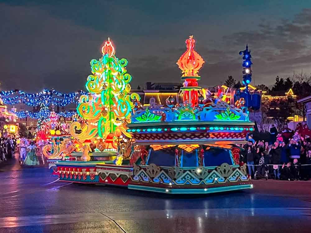 Mickey’s Dazzling Christmas Parade illuminated floats and performers at Disneyland Paris.