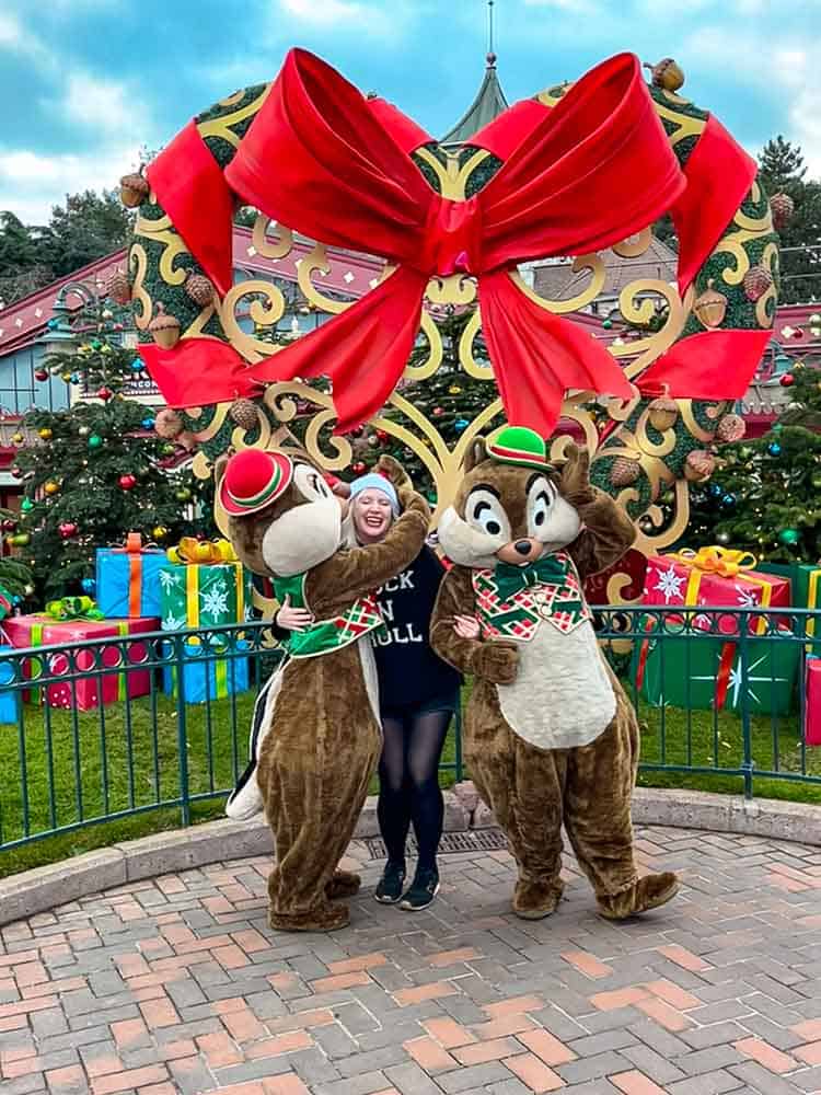 Disney blogger Carrie-Anne Hall meeting Chip and Dale in Christmas costumes at Disneyland Paris.