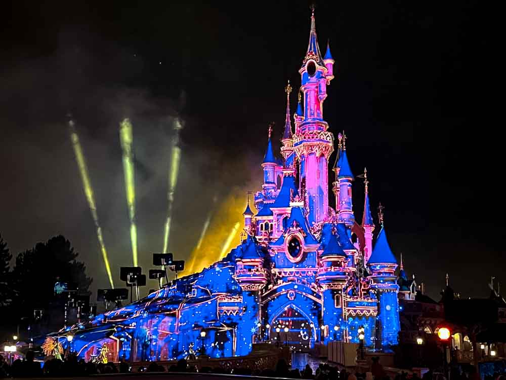 Disneyland Paris Tales of Magic fireworks and fountains over Sleeping Beauty Castle.
