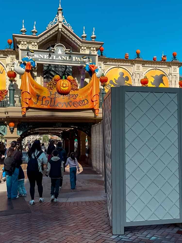 Happy Halloween banner hanging above Disneyland Paris entrance for Halloween 2025