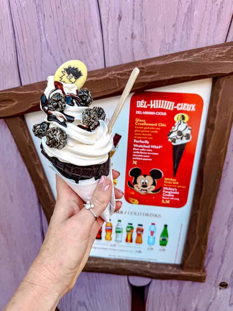 Disneyland Paris Cruella de Vil Wicked Whirl cone with vanilla ice cream, chocolate drizzle and black popcorn