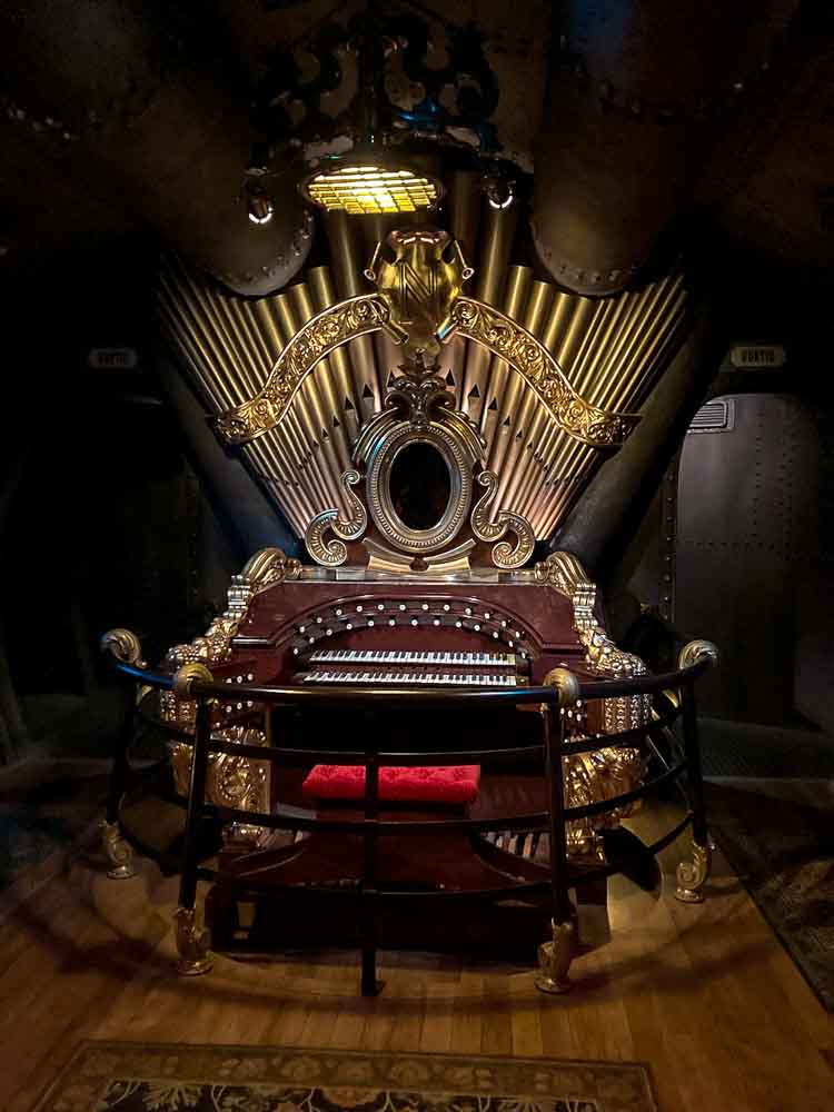 Ornate gold organ room inside Les Mystères du Nautilus at Disneyland Paris, one of the hidden indoor gems on a rainy park day.