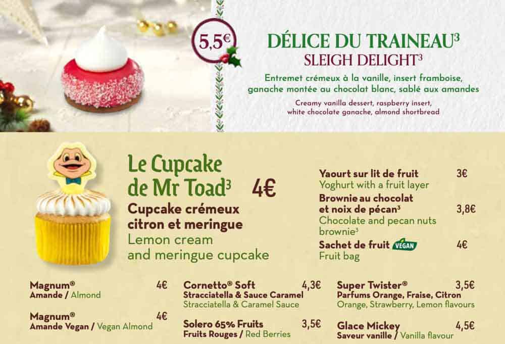 Toad Hall Restaurant menu board featuring the Sleigh Delight dessert and traditional fish and chips, part of the Disneyland Paris Christmas menus 2025.