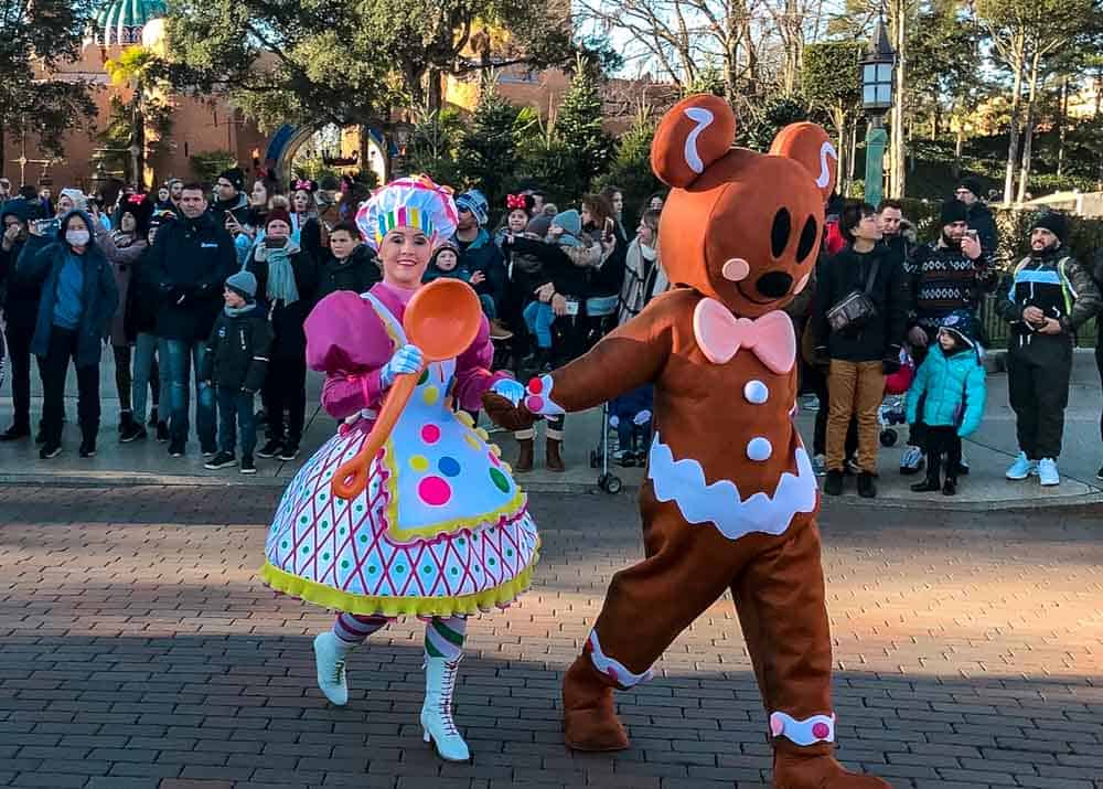 Dancing gingerbread and candy characters during winter entertainment at Disneyland Paris in January.
