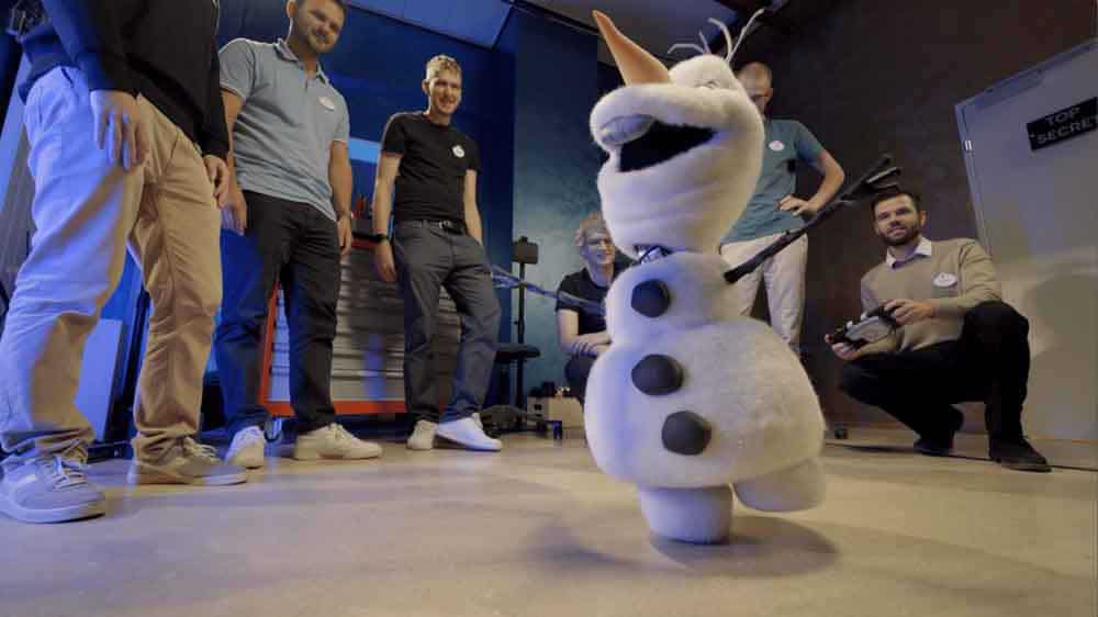 Walt Disney Imagineering team testing the Robotic Olaf for Disneyland Paris in the workshop.
